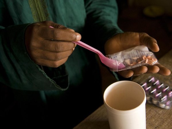 Photo of hands preparing medication